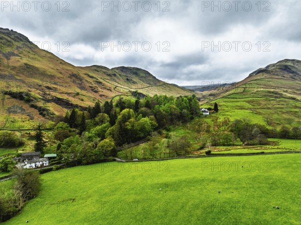 Farms and Mountains over road A591 from a drone, Grasmere Lake, Grasmere, Ambleside, Lake District,