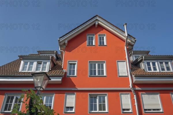 Red pointed gable facade with dormers, blue sky, Isny, Swabia, Baden-WÃ¼rttemberg, Germany