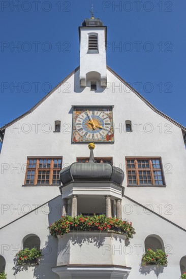 West faÃ§ade with clock and floral decoration, town hall, Kempten, AllgÃ¤u, Bavaria, Germany