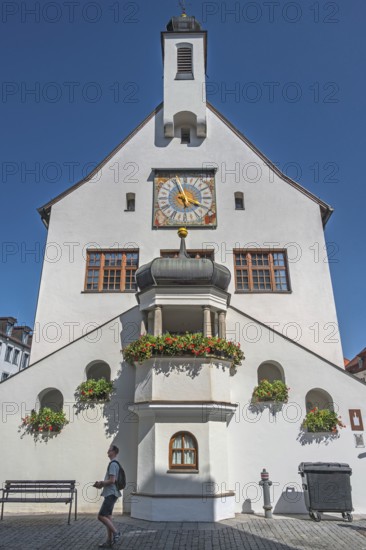 West faÃ§ade with clock, floral decorations and strollers, town hall, Kempten, AllgÃ¤u, Bavaria,
