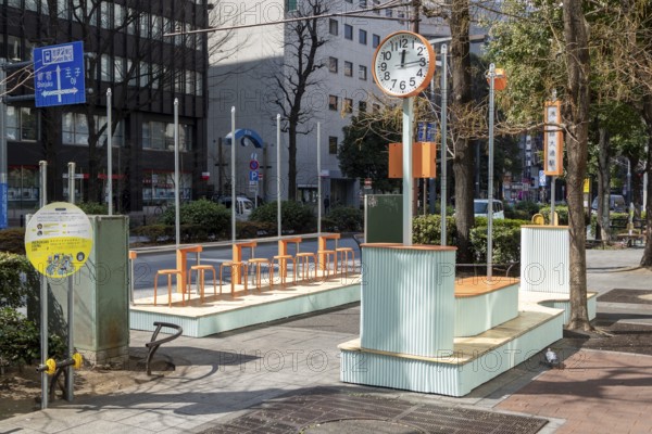 Urban design, close-up, orange Seiko clock and benches, Ikebukuro Living Loop, Public Furniture,