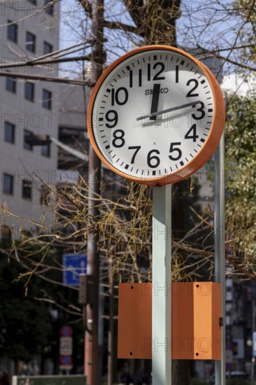 Urban design, close-up, orange Seiko clock, Ikebukuro Living Loop, Public Furniture,