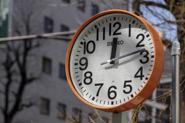 Urban design, close-up, orange Seiko clock, Ikebukuro Living Loop, Public Furniture,