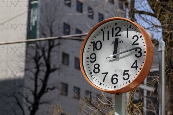 Urban design, close-up, orange Seiko clock, Ikebukuro Living Loop, Public Furniture,
