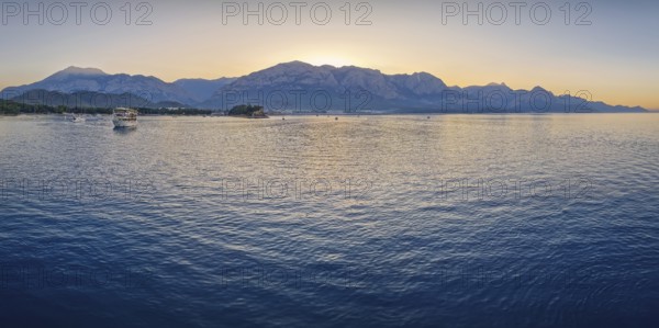Seascape sunset panorama over the Mediterranean Sea near Kemer, Turkey. Panoramic view to the