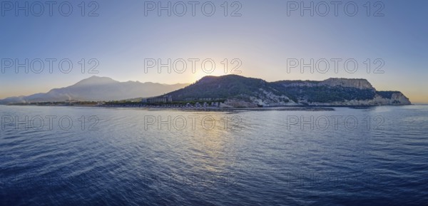 Seaside panoramic view of Kiris resort near Kemer, Turkey, with sunset over the majestic Taurus