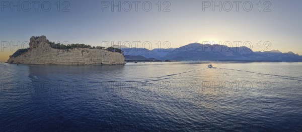Scenic sunset panorama over Turkish Mediterranean coastline, with majestic Taurus mountains in the
