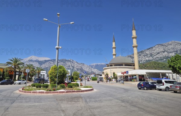 KEMER, TURKEY - JULY 5, 2025 Kemer city centrum view with grand mosque Huzur Camii Dzamija with two
