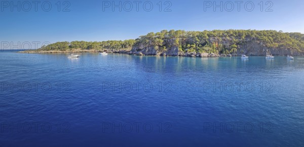 Wonderful Paradise bay of Camyuva, Kemer, Turkey. Scenery panoramic view of the coast with boats on