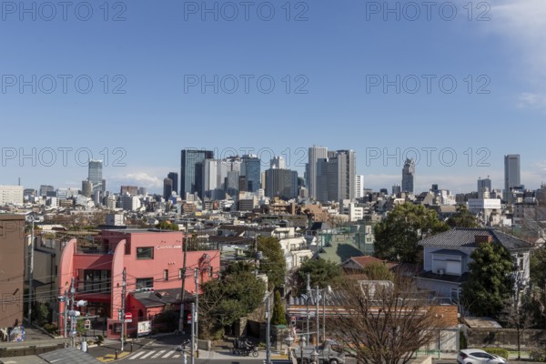 Modern architecture, view over the rooftops of the city to the glass facades of skyscrapers against