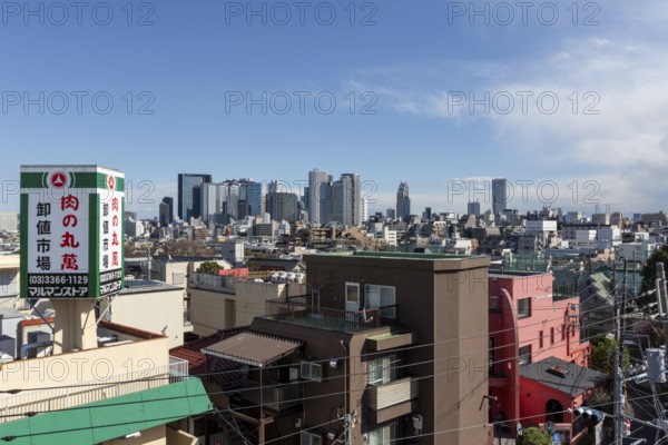 Modern architecture, view over the rooftops of the city to the glass facades of skyscrapers against