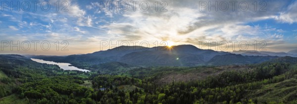 Panorama of Sunset over Mountains and Coniston Water from drone, Lake District National Park,