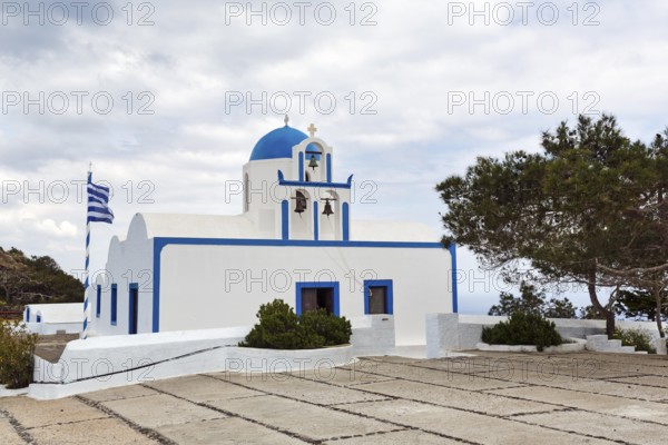 Orthodox chapel Mikros Profitis Ilias with blue dome, hiking trail from Fira to Oia, Thira,