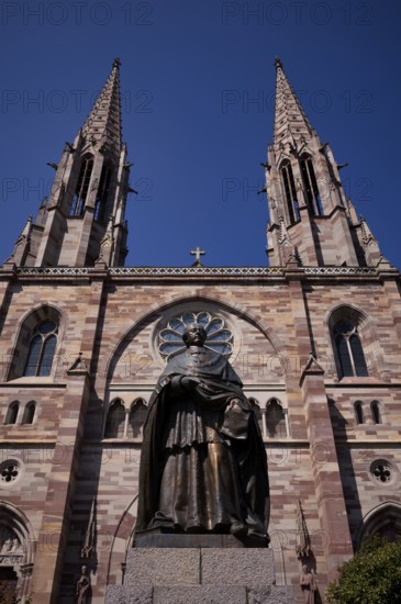 Monument, statue of Charles Emile Freppel, theologian and Bishop of Angers, in front of the church