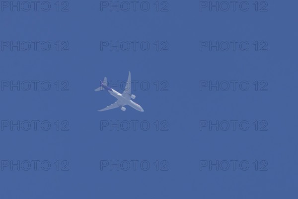 Airbus A300-600RF jet aircraft of FedEx Express airlines in flight in a blue sky, England, United
