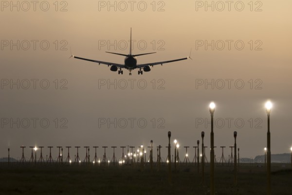 Boeing 737 jet passenger aircraft of Ryanair airlines in flight landing at sunset at London