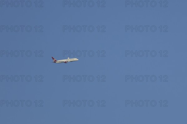 Boeing 787-9 Dreamliner jet passenger aircraft of Virgin Atlantic airlines in flight in a blue sky,
