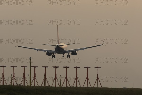 Boeing 737 jet passenger aircraft of Ryanair airlines in flight landing at sunset at London