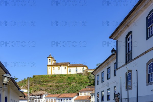 Baroque church on top of the hill among the colonial houses of the city of Ouro Preto, Ouro Preto,