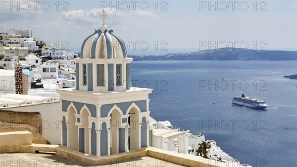 Blue and white bell tower and view of the sea, cruise ship, Firostefani, Thira, Santorini,