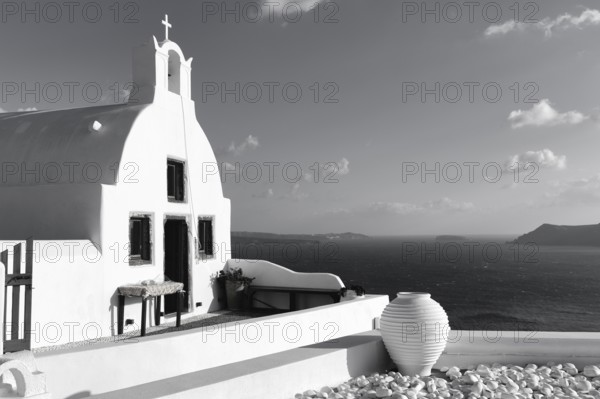 White architecture, orthodox church by the sea, monochrome, Oia, Santorini, Cyclades, Aegean Sea,