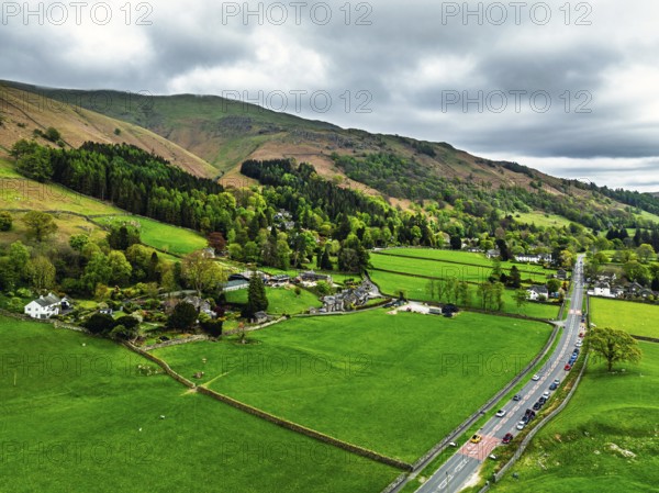 Farms and Mountains over road A591 from a drone, Grasmere Lake, Grasmere, Ambleside, Lake District,