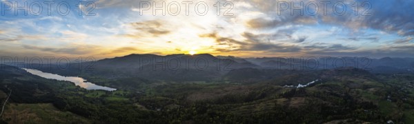 Panorama of Sunset over Mountains and Coniston Water from drone, Lake District National Park,
