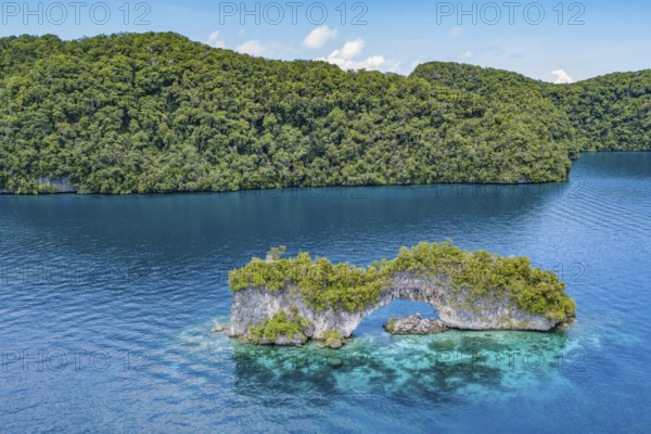 Aerial view bird's eye view of rock arch Natural Arch in lagoon of island paradise island state