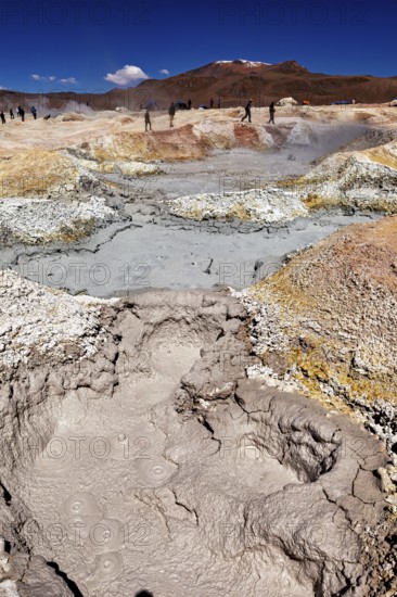 Vast geothermal activity area with fumaroles and people, The mud volcanoes and fumaroles on the