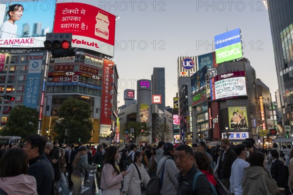 Crowd crossing the zebra crossings of Shibuya Crossing, world-famous intersection in Shibuya