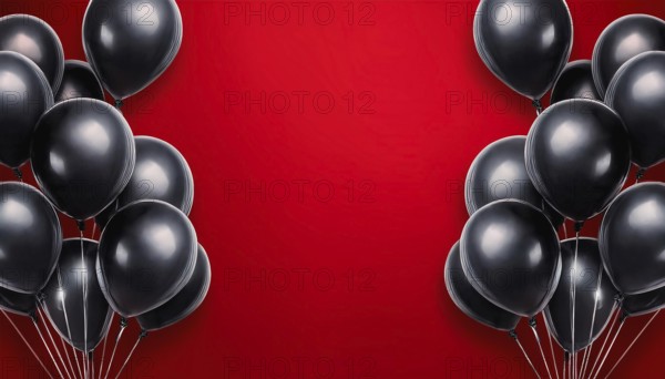 A striking arrangement of black balloons on a vibrant red background with open space in the center,