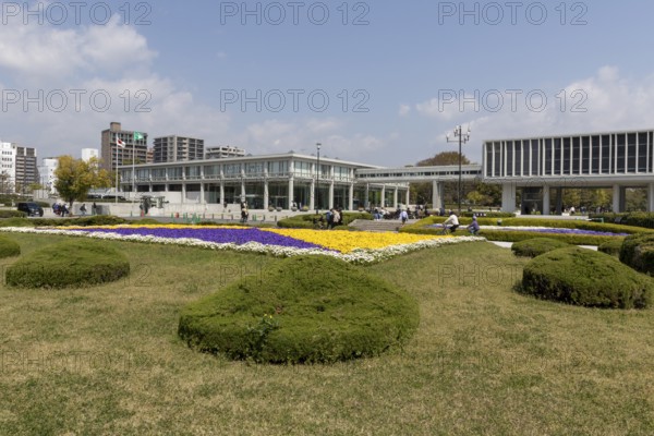 Colourful flower beds in front of the Hiroshima Peace Museum, tourist attraction, UNESCO World