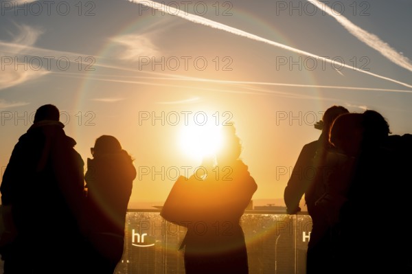 The golden hour delights visitors to the Main Tower. Banking district, Frankfurt am Main, Hesse,