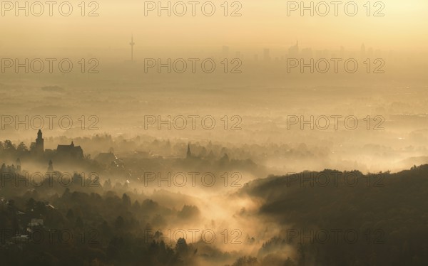 Frankfurt skyline sinks into the early morning fog. Dettweiler Tempel, Königstein im Taunus, Hesse,