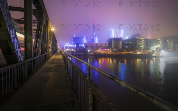 West cogeneration plant shines through dense fog. Gutleutviertel, Frankfurt am Main, Hesse, Germany