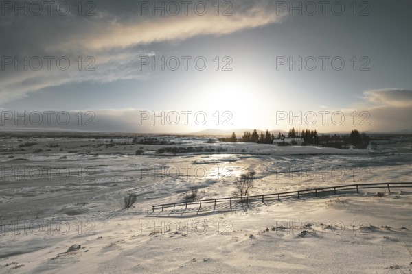 Ice landscape in Thingvellir National Park. Frozen expanse and soft light. Golden Circle,