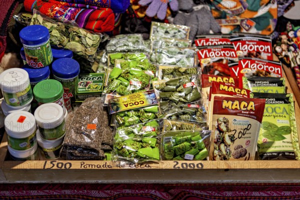 Market stall with a selection of coca products and traditional medicinal items in colourful