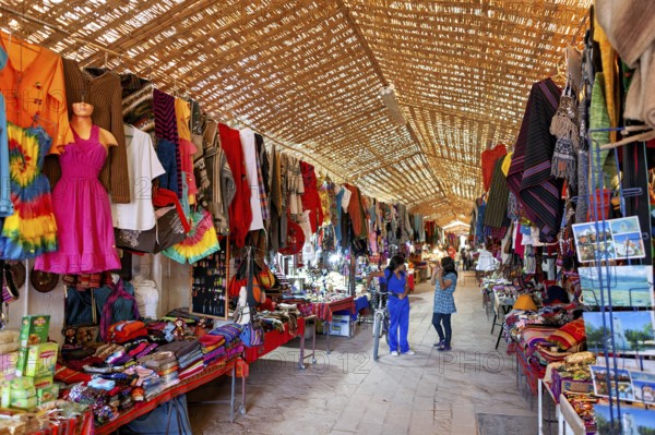 A lively market with a variety of colourful clothing, textiles and souvenirs. Traditional crafts