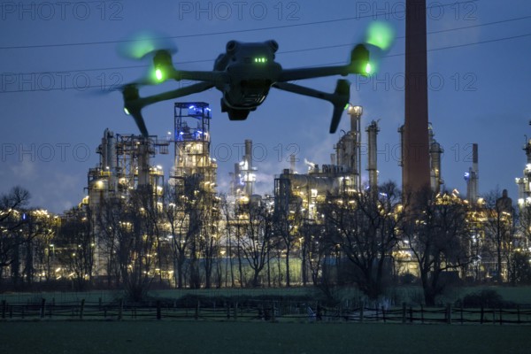 Symbolic image, photomontage, reconnaissance, spying with drones in industrial plants, critical
