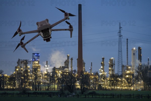 Symbolic image, photomontage, reconnaissance, spying with drones in industrial plants, critical