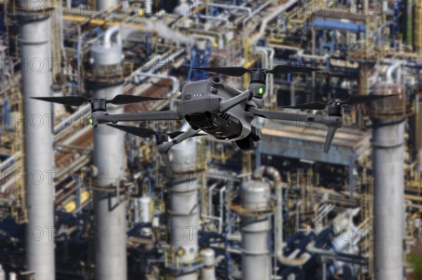 Symbolic image, photomontage, reconnaissance, spying with drones in industrial plants, critical