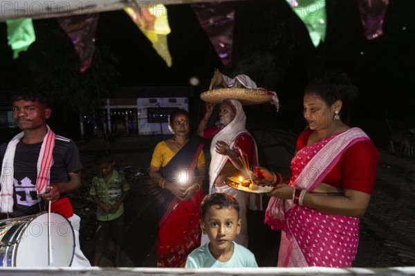 Members of the tea tribe community celebrate the vibrant Karam Festival with traditional rituals at