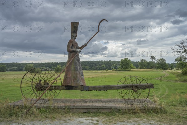 Sculpture Charon ferryman into the underworld, dyke near Mödlich, Brandenburg, Germany