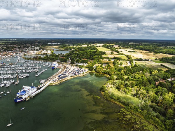 Wight Light car ferry to Isle of Wight on Lymington River and marina from drone, Lymington, New