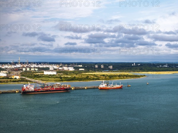 Gas tankers over refinery Esso Oil Terminal from drone, Southampton, Hampshire, England, United