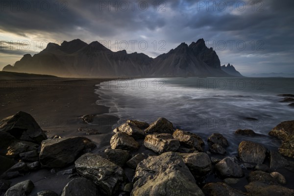 Mountains, mountain range, beach, sea, waves, surf, reflection, clouds, evening light, coast,