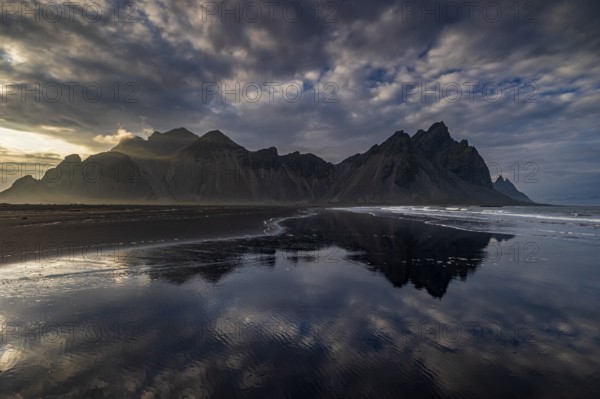 Mountains, mountain range, beach, sea, waves, surf, reflection, clouds, evening light, coast,