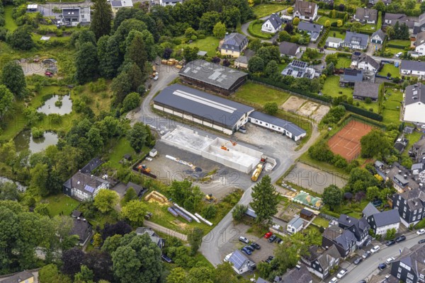 Aerial view, horse farm and riding stable, construction site with new building, tennis courts,