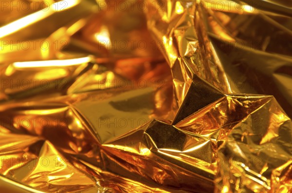 Full frame creased gold foil background