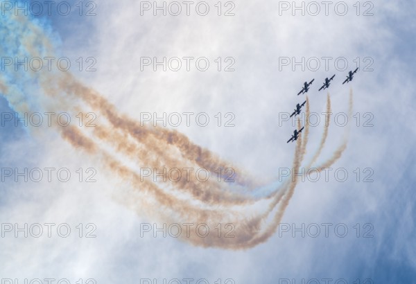 Air show of the Frecce Tricolori aerobatic team of the Italian Air Force with colored smoke trails